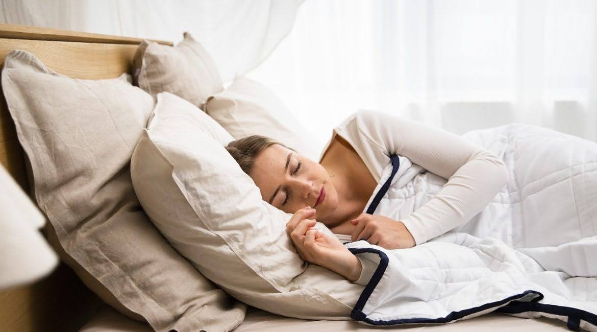woman sleeping after taking sleep support stress relief CBD gummies a nightly ritual and sleep routine