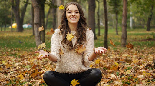 happy relaxed woman sitting after taking CBD tincture