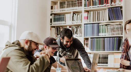 people laughing in office after taking anxiety relief CBD gummies