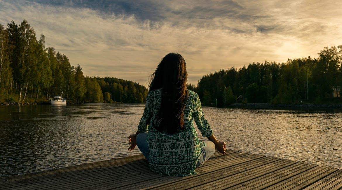 woman meditating after taking anxiety relief CBD gummies